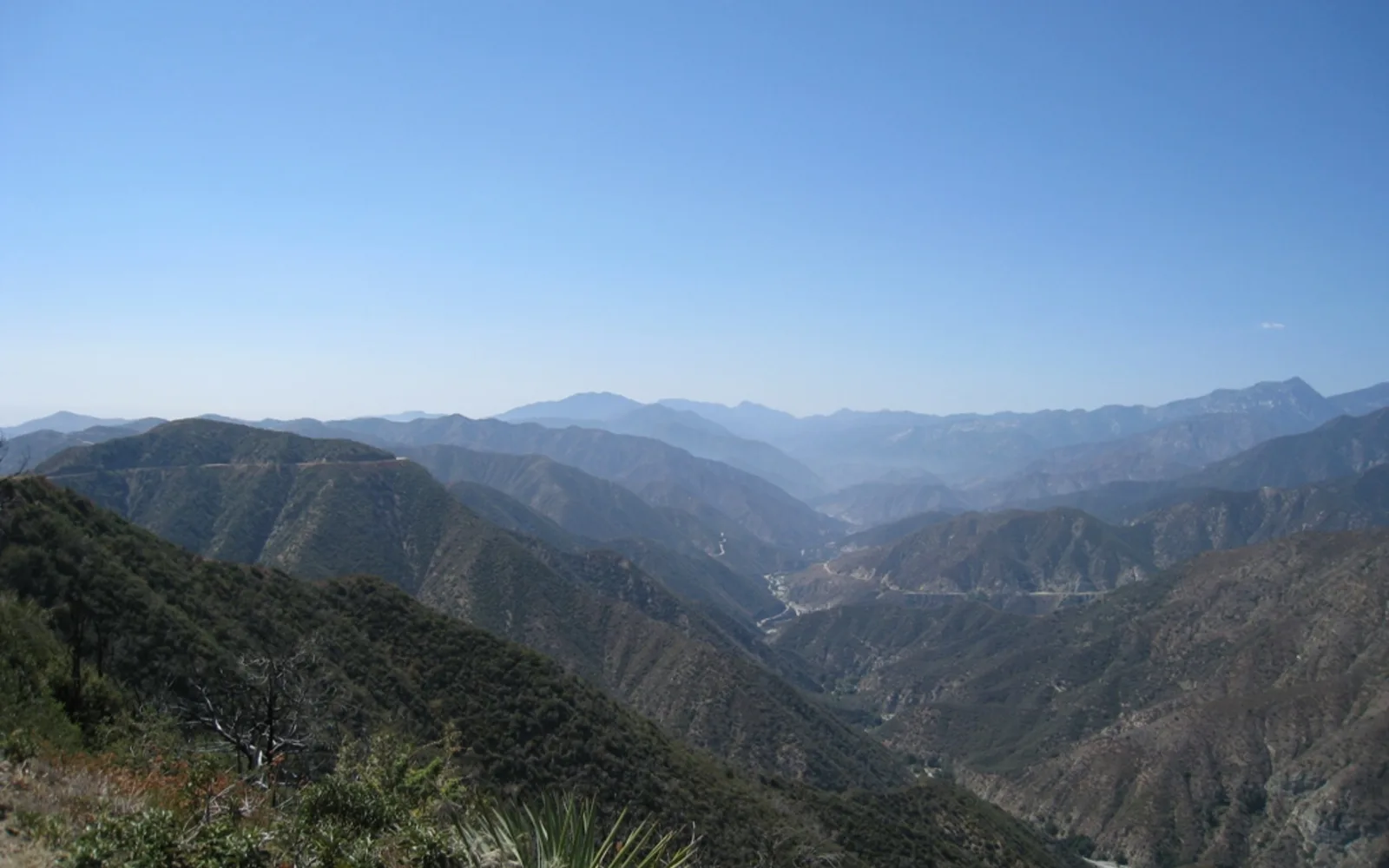 A landscape view of the San Gabriel Mountains rising above foothills